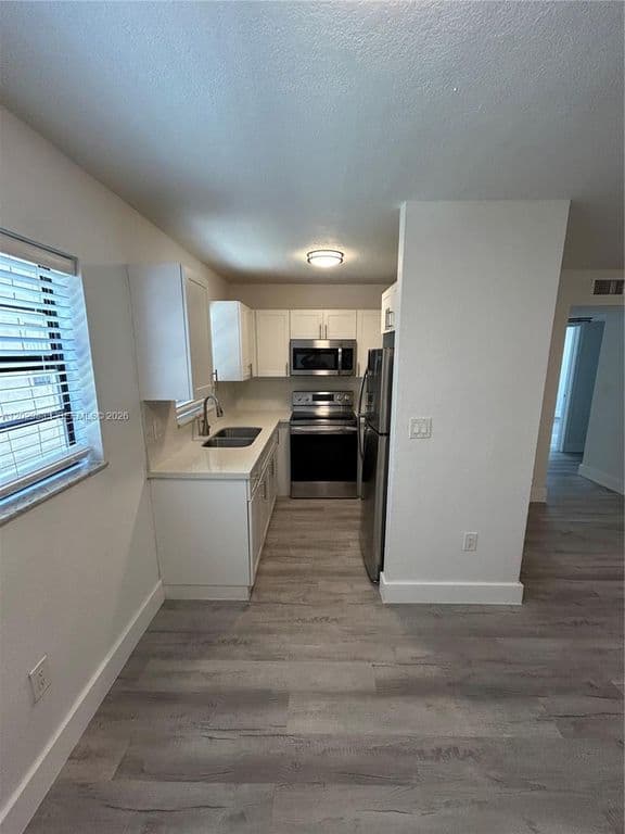 2+1 Condo — 5960 W 25th Ct APT 102