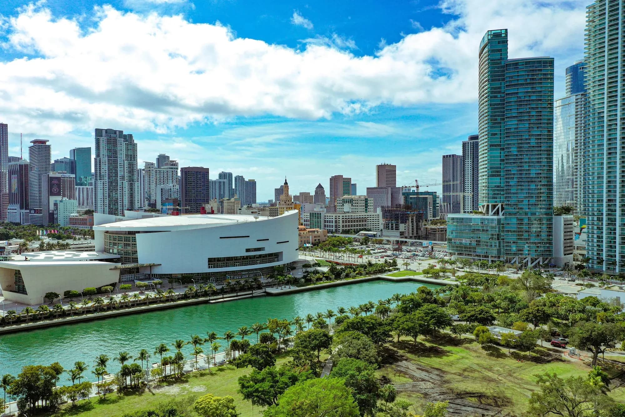 A downtown skyline, an arena and a waterfront park — aerial view