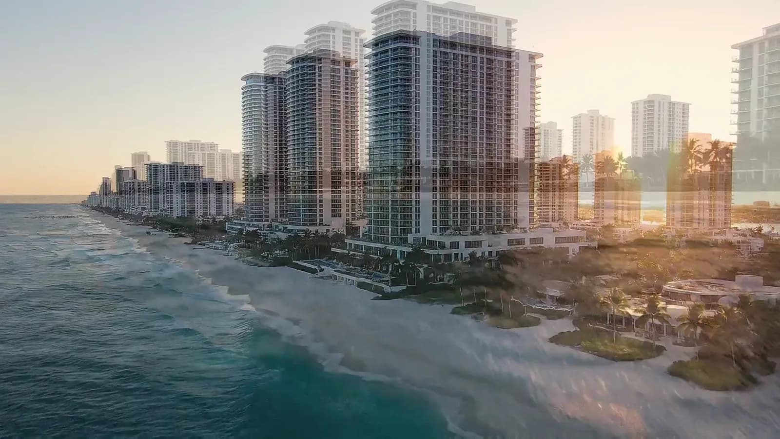 Miami shoreline and residential towers from above at sunset